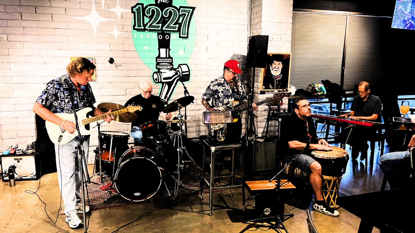 Live music at The 1227 Taproom, beneath the venue's teal logo