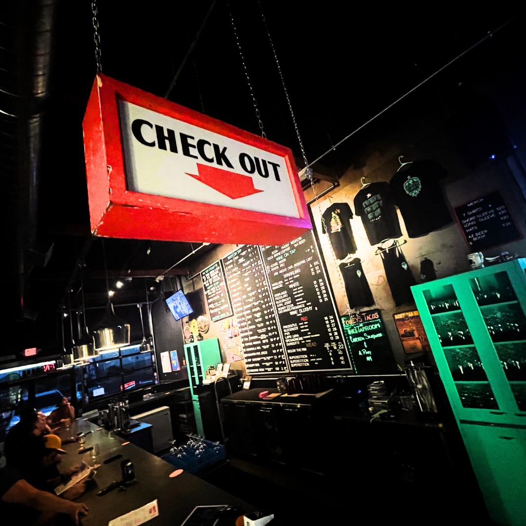 Craft beer taps and the chalkboard menu inside The 1227